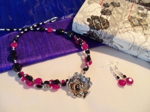 Tibetan Silver Flower with stunning agates. Shown with Handmade purse &amp; raw silk clutch bag.
