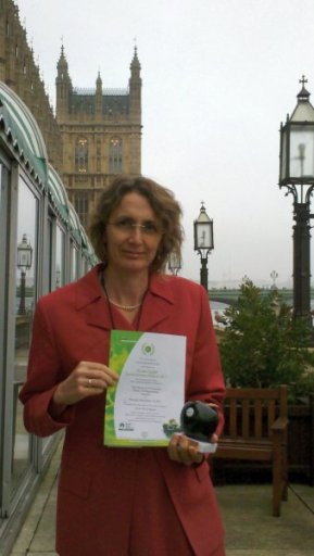 Tina shows off the Bronze Green Apple Award at the Houses of Parliament