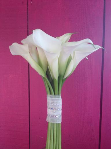 hand tied bouquet of white calla lilys