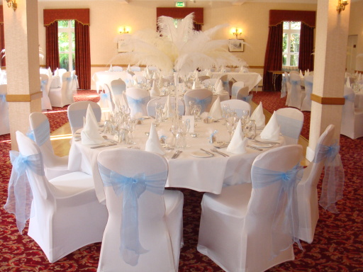 Stunning chair covers with light blue sash!