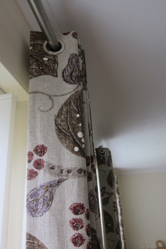 eyelet headed curtains in William Yeoward fabric by Designers Guild