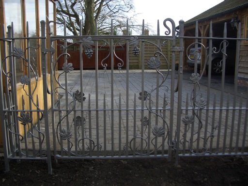 Bespoke 'grapevine' gate and railings.