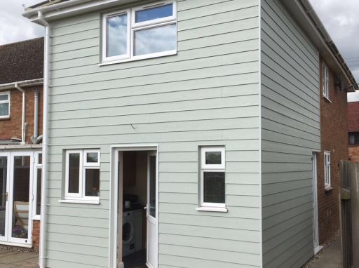 2 storey house extension with hardiboard planking.
