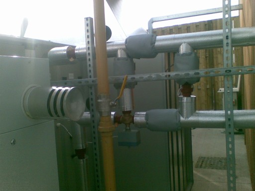 Pipework insulated with phenolic and covered with stucco aluminium, removable valves covers