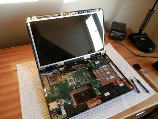 first computer repair dismantaled laptop
