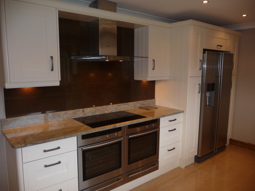 Cream wood fitted kitchen
