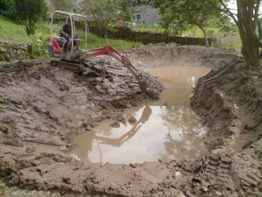 Claying lining a pond after digging out