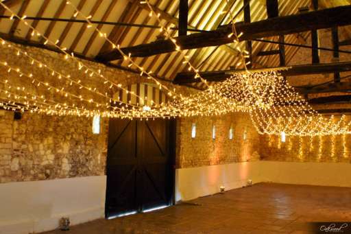 Fairy light canopy and gold uplighting