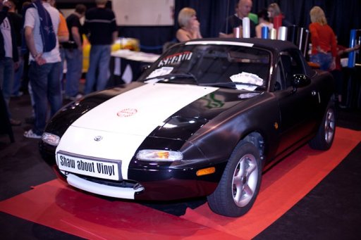 Mazda MX5 wrapped with black carbon and gloss vinyls for exhibition