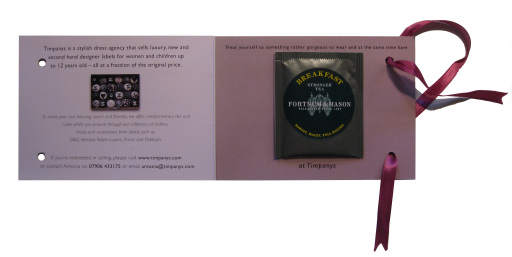 Marketing campaign mailer for luxury dress shop launch