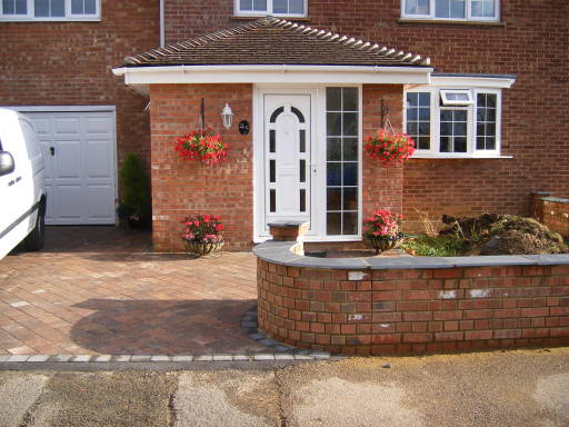 New Driveway and Curved Wall completed by A.Williams Landscaping Service.