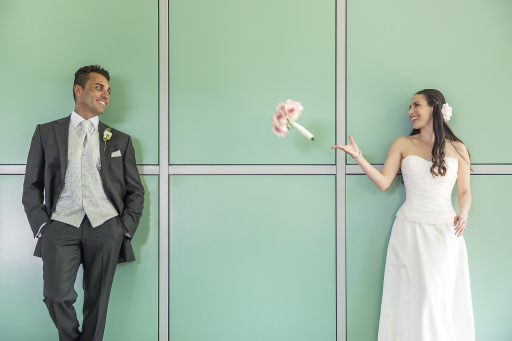 Bride tossing the bouquet to the groom