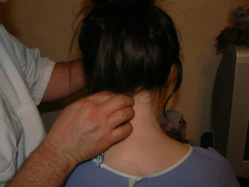 chiropractor palpates as part of neck pain treatment