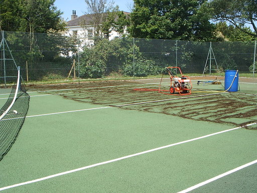 Tennis court undergoing cleaning