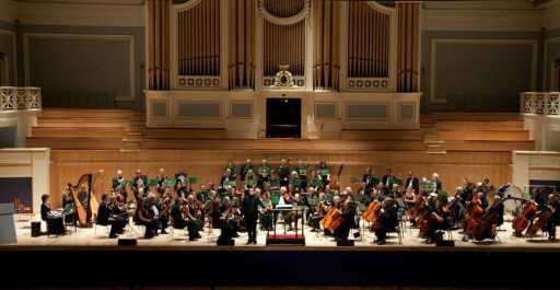 The Orchestra on stage at DeMontfort Hall, Leicester