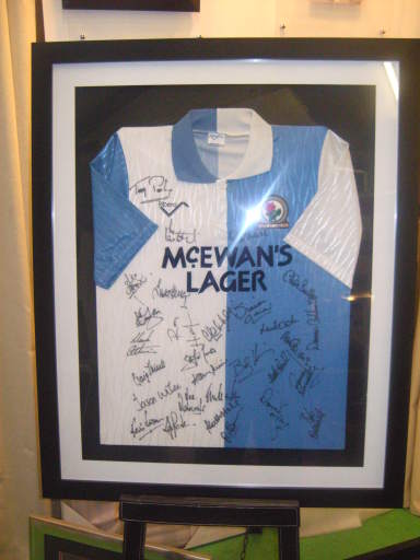One of many framed football shirts.