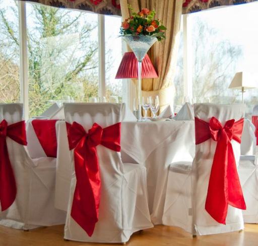 linen chair covers with red taffeta chair sashes