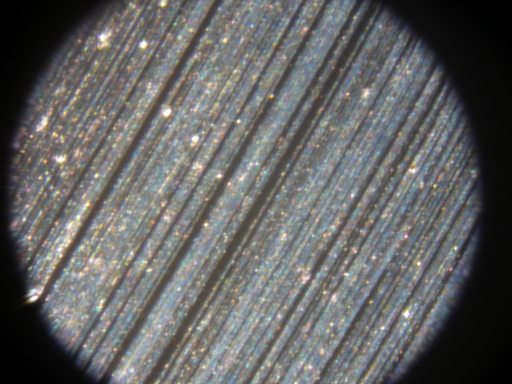 Microscopic area of hard drive platter damage