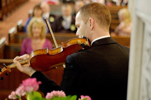 Violinist Performing at Church Wedding