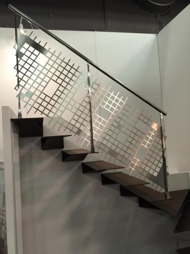Laser cut stainless steel balustrade on a floating staircase