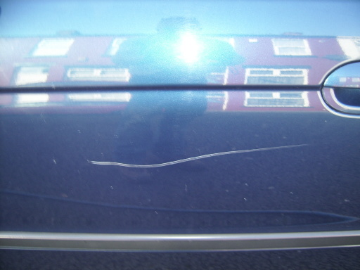 bmw door scratch before