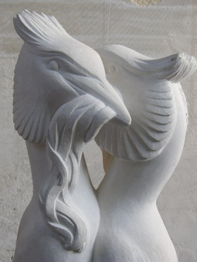 Stone carving of great crested grebes