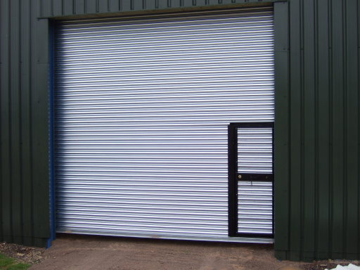 galvanised roller shutter door with wicket door