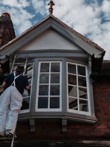 Exterior painting and woodwork restoration.