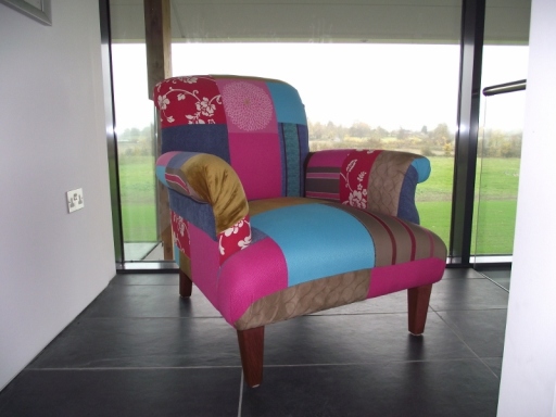 Hand made armchair upholstered in a patchwork design using clients own fabrics