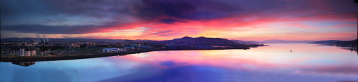 Panoramic view of sunset over Moray Firth and Inverness harbour.