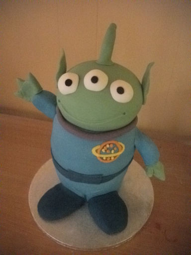 Hand carved toy story alien cake.