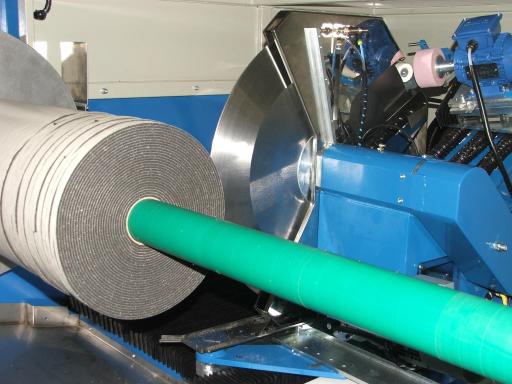 ALS automatic roll slitter with automatic blade grinder and auto blade angle for precision slitting.