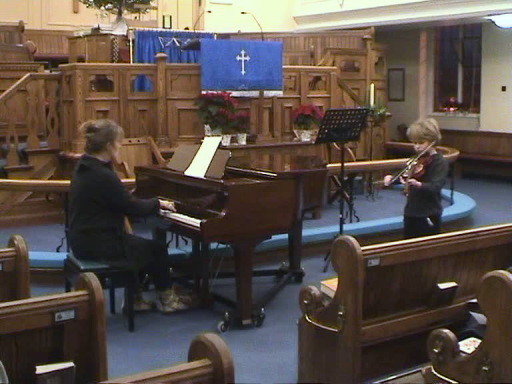 Accompanying a pupil at the Christmas concert.