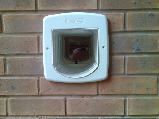 carflap fitted through a brick wall