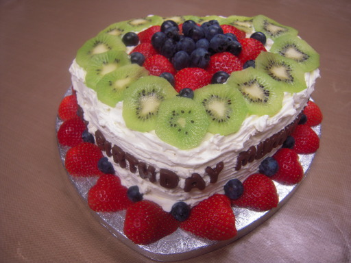 Egg Free Lemon Sponge with Fresh Cream, Strawberries, Blueberries, Kiwi Fruits and Chocolate Message