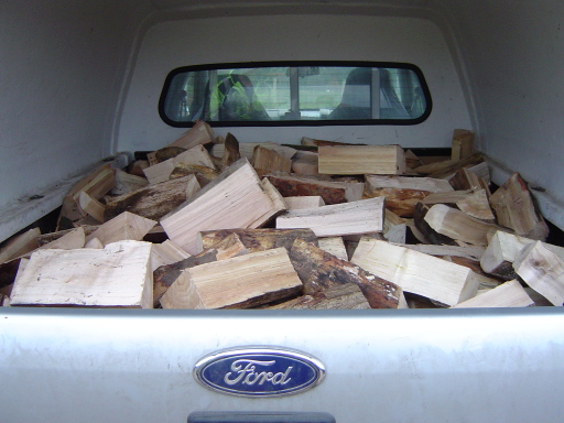 A loose pick up load of hardwood logs