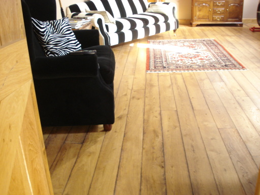 Aged oak boards give a rich textured back drop to this room