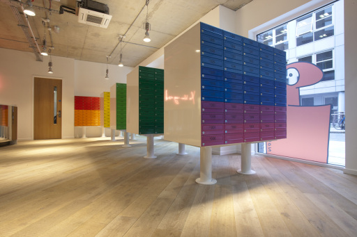 Colourful banks of freestanding mailboxes.