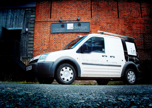 Vehicle Graphics and Wooden Sign
