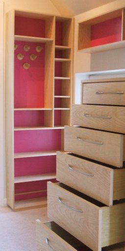 Fitted dressing room cabinets in ash.