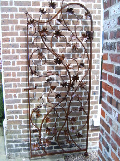 Hand made gate with flowers.
