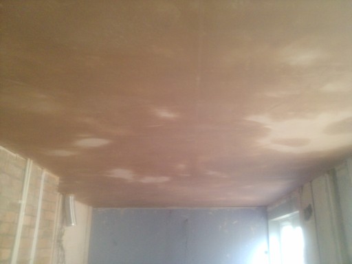 Dry Line boards were fixed to joists in Kitchen to form new ceiling, now plaster skimmed to good.