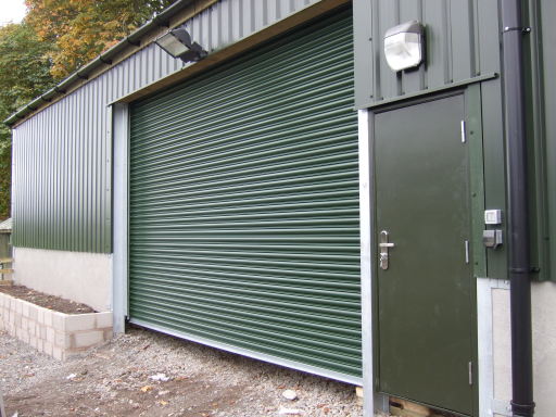 plastisol coated roller shutter with powder coated personnel door