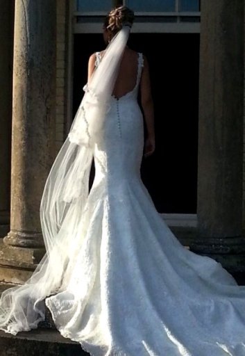 Lace wedding dress, custom made with long train and low back.
