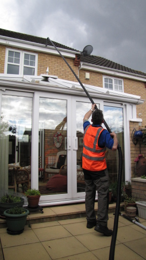 Gutter cleaning over a conservatory