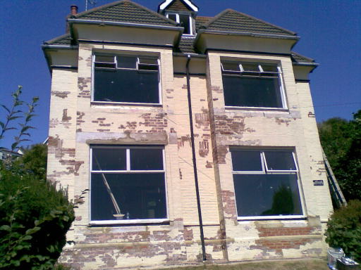 Blown brickwork, loose pointing, penetrating damp and flaking paint