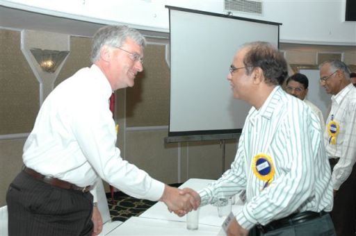 Martin shaking hands with Dr Baldev Raj after a keynote