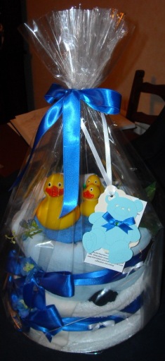 Perfectly wrapped nappy cake with ingredient label great for baby showers