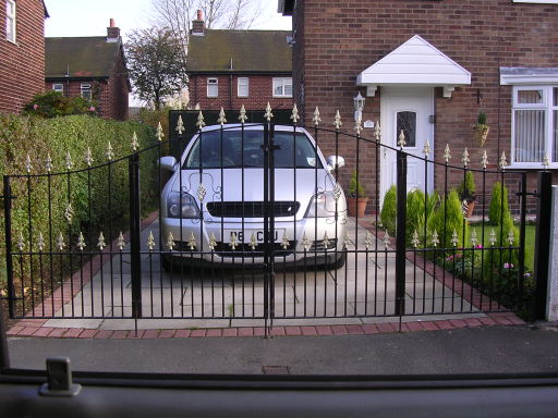 example of double concertina folding driveway gates