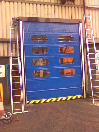 Fabric energy saving fast action door